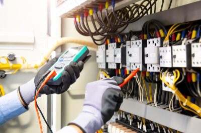 Energy Safe Electric team maintaining equipment